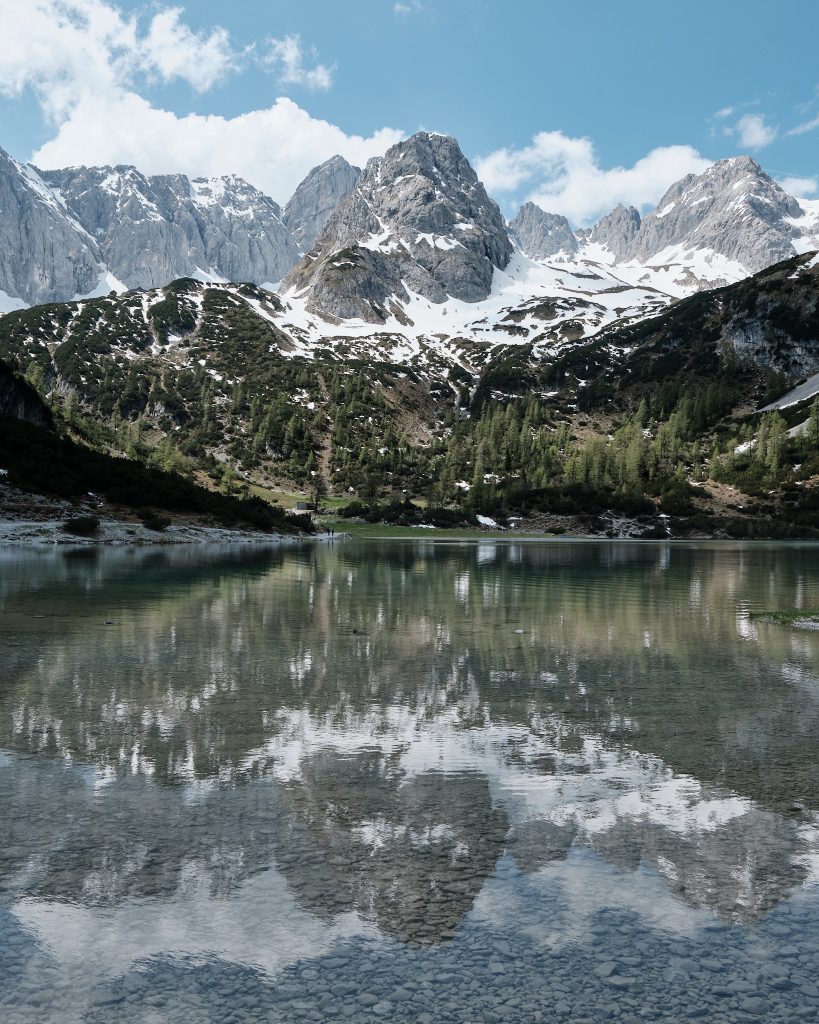 The surrounding mountains are reflected in the Seebensee